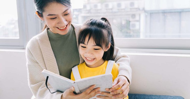 Mother and daugther practising chinese oral